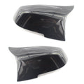 Pair of paint bright black BMW rear-view mirror replacement shells for 3 Series and 4 Series models.