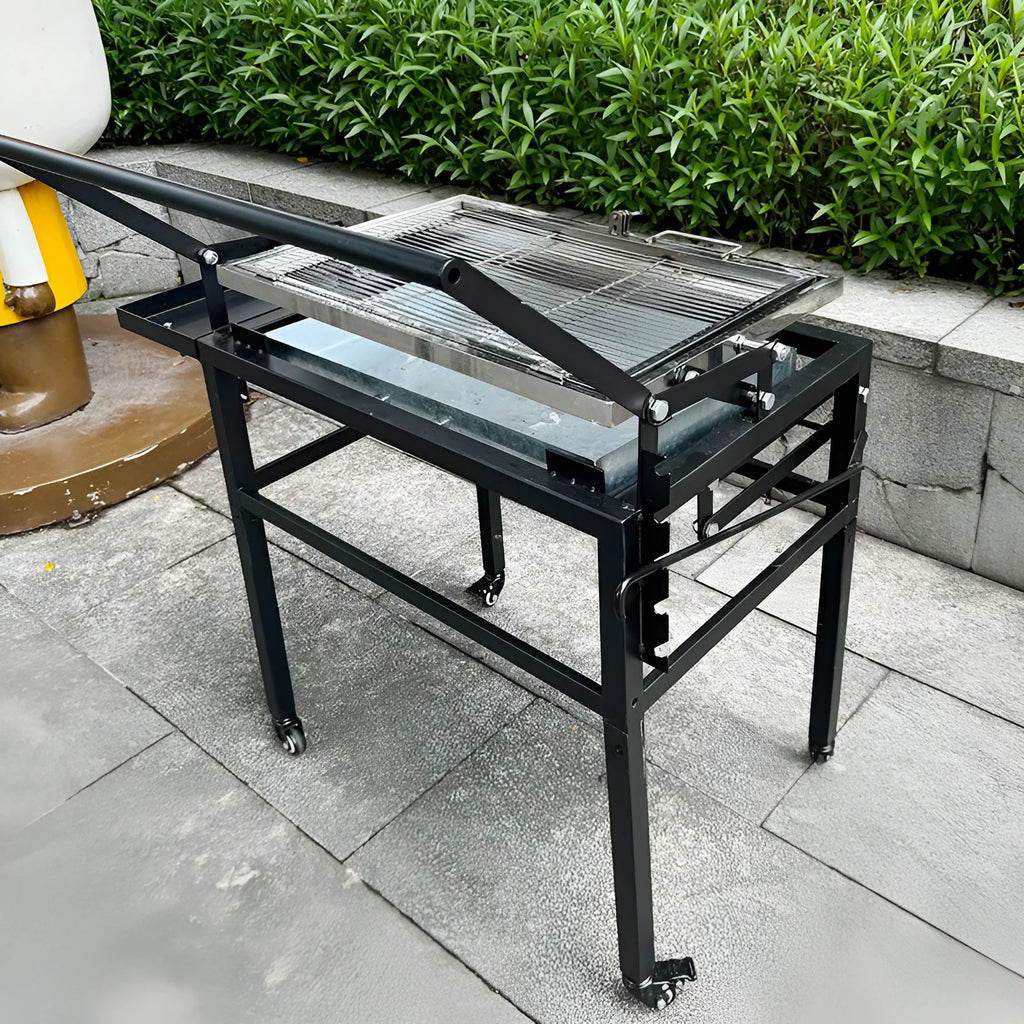 Large foldable portable charcoal grill oven set up in a garden
