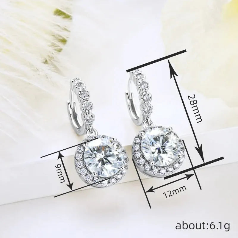 Shiny white gold copper geometric earrings for women with round ring shape on a white background