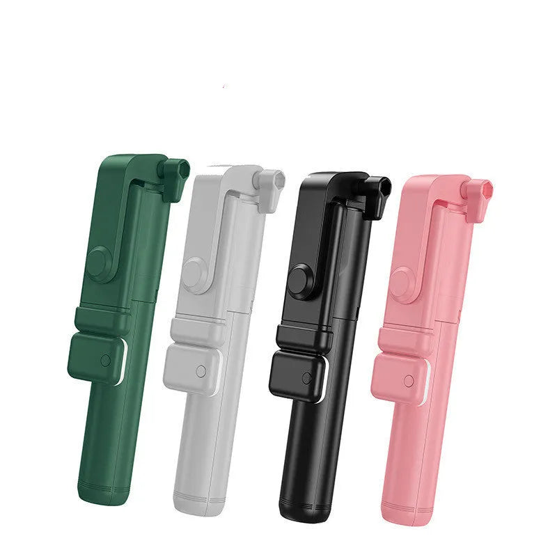 Black Bluetooth selfie stick with extended tripod legs and a phone mounted in its 360-degree rotating holder.