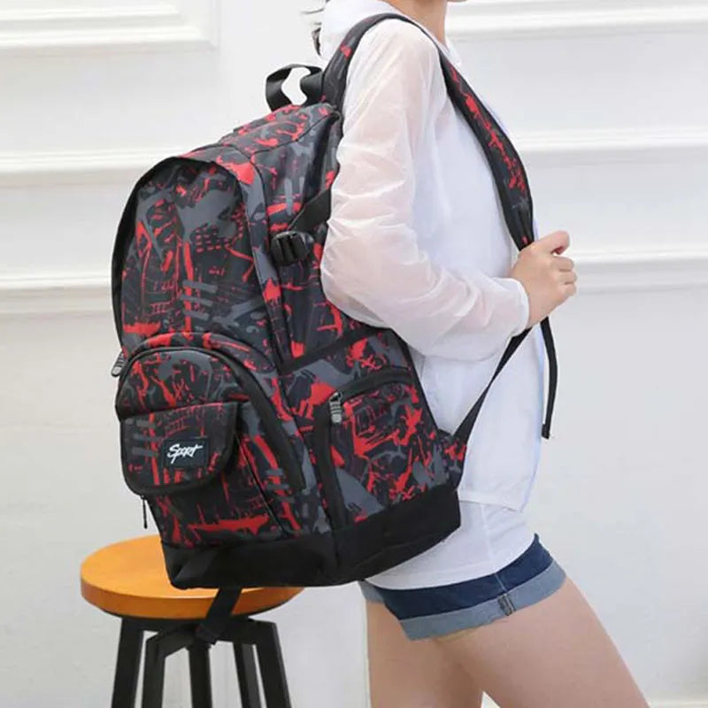 Classic large blue nylon backpack with multiple compartments shown from the front.