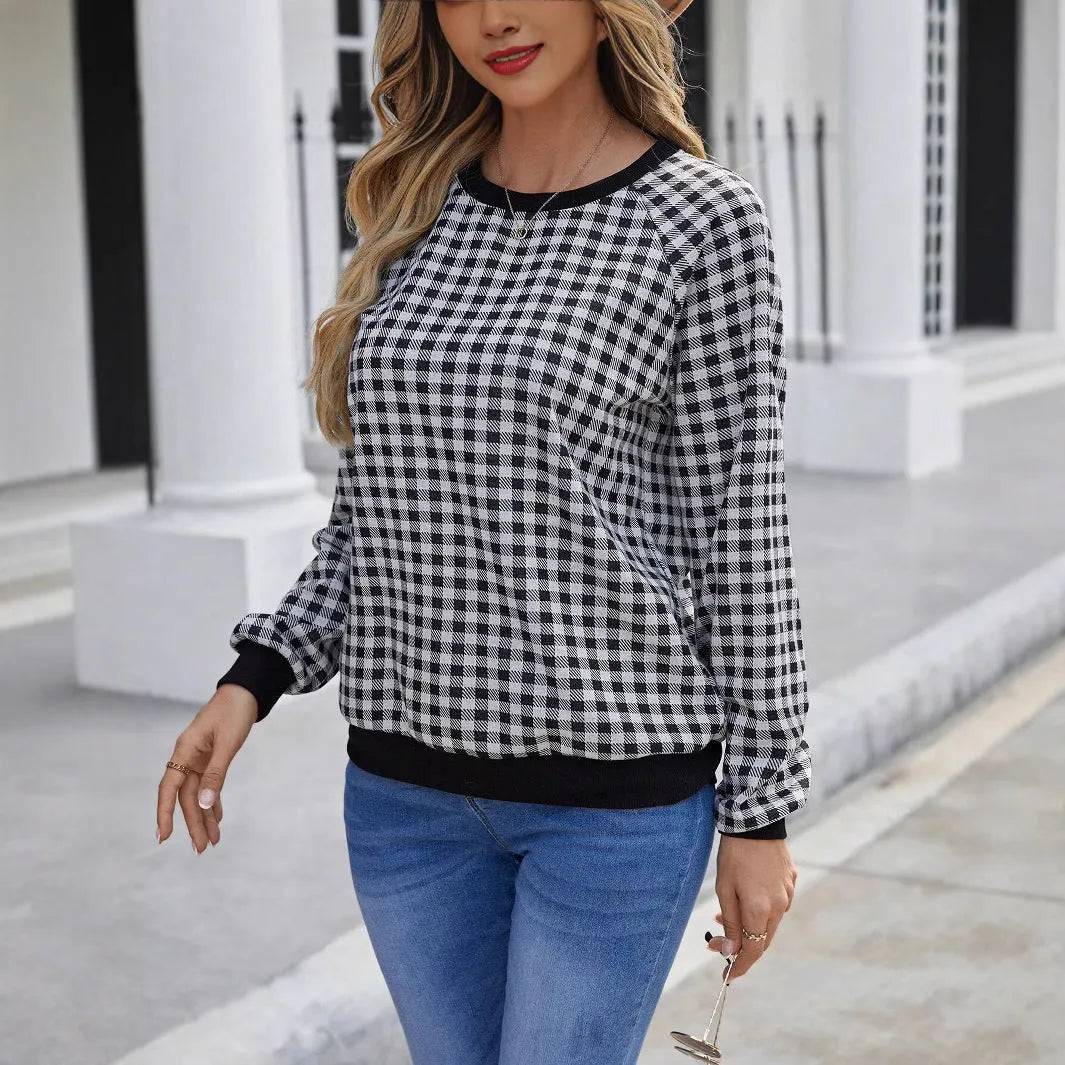 Black Japanese plaid pattern long sleeve polyester pullover sweater on a hanger