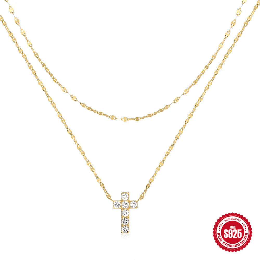 S925 sterling silver double layer twin diamond cross pendant necklace on a clavicle chain, shown in gold and white gold colour finishes.