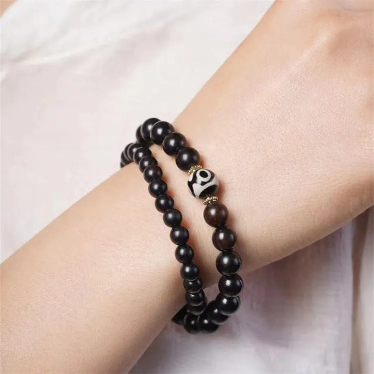Ebony bracelet with Tibet beads design showing two-tone colour circles and 8mm diameter
