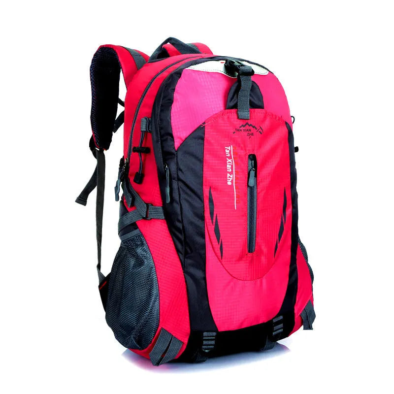 Large red Oxford cloth travel backpack with double straps, showing front compartment and buckle closure.