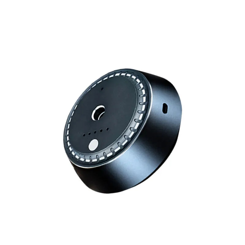 Black metal car aroma diffuser measuring 9cm by 4.5cm with USB charging port