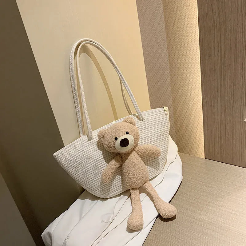 Cotton and linen woven shoulder bag in dumpling shape with three-dimensional pocket and double straps