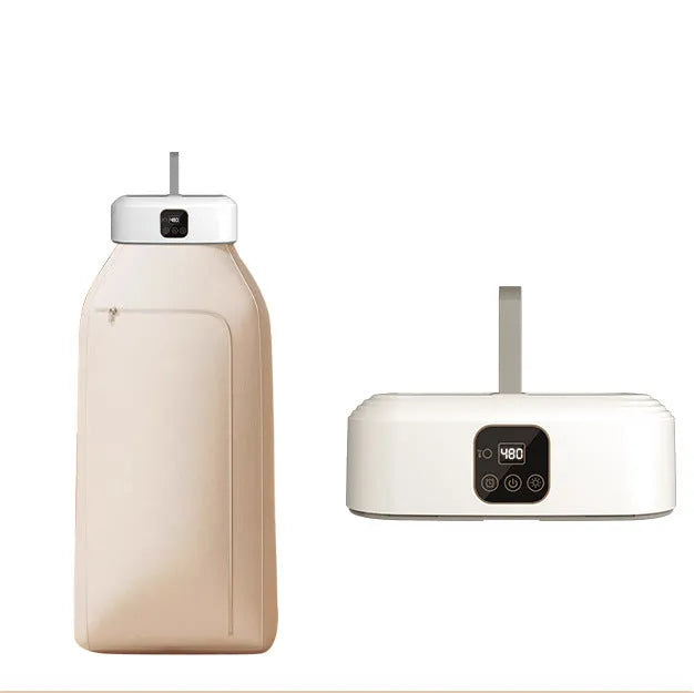 White cylindrical compact clothes dryer with remote control folded for storage