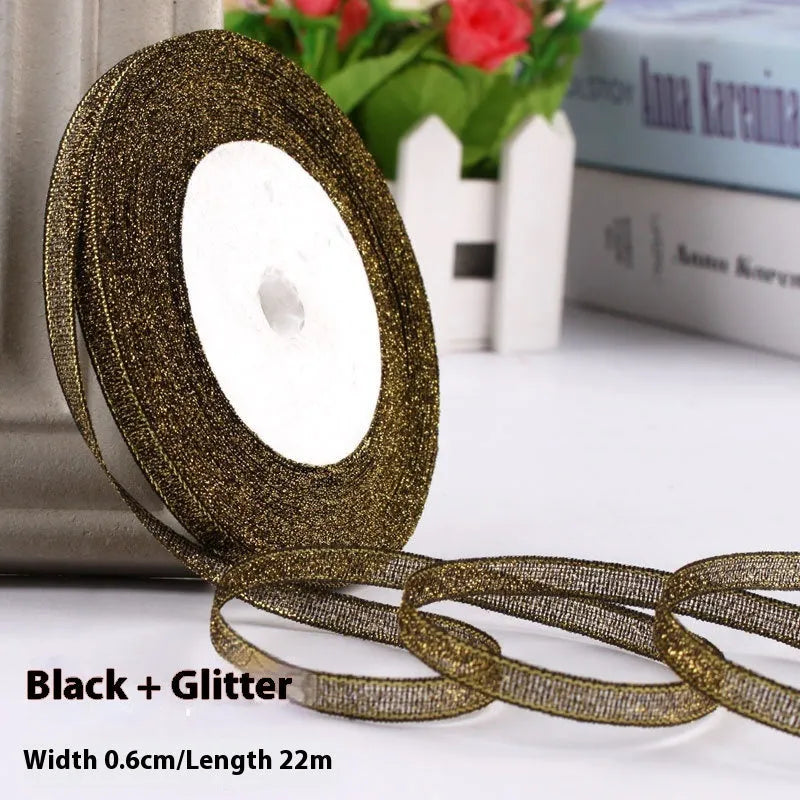 Roll of 0.6cm wide polyester gift ribbon in various colours including gold leaf, coffee and sky blue options
