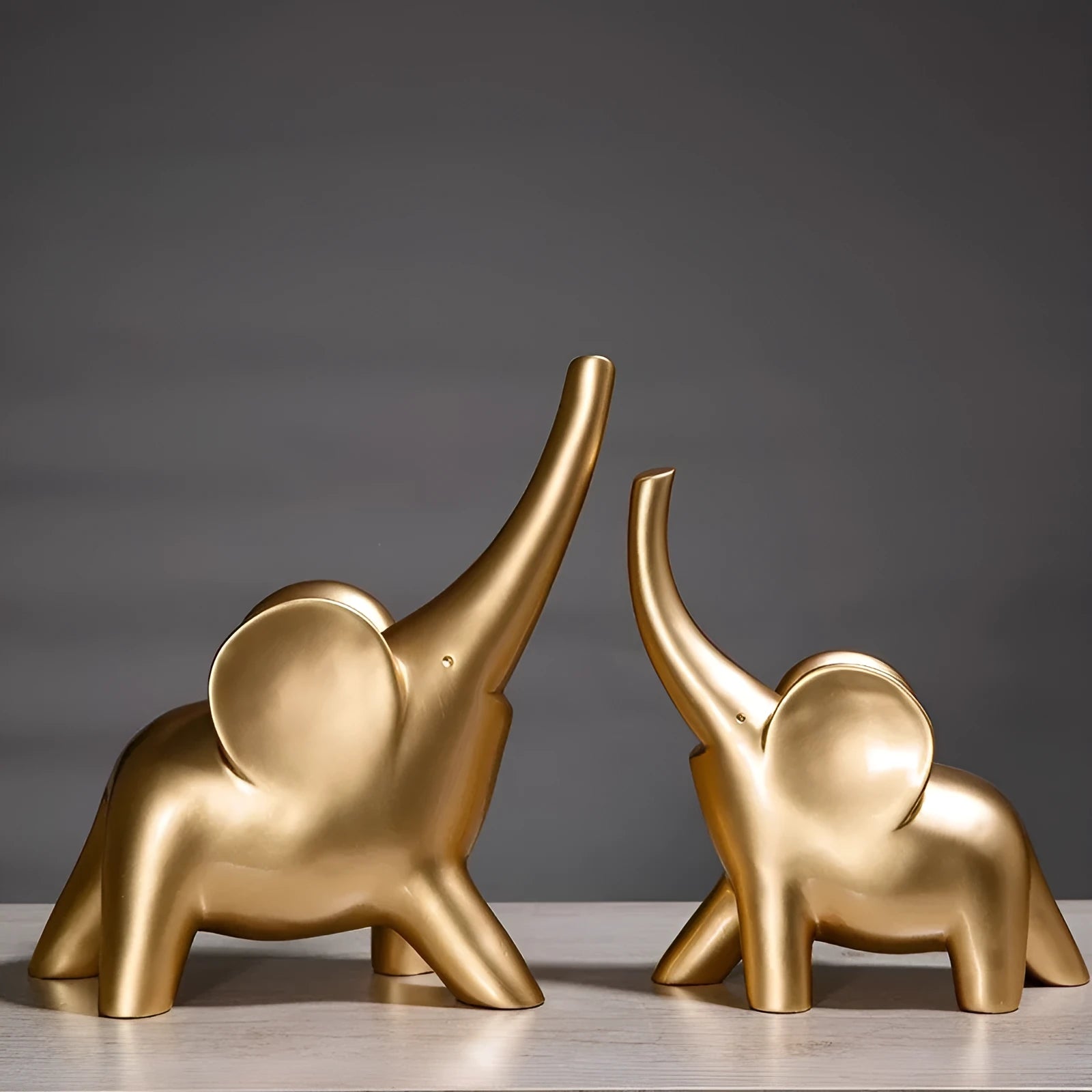 Modern Fortune Bring Elephant resin ornament in rose gold on a plain background