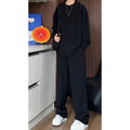 Men's black long sleeve polo shirt and trousers two-piece casual suit on hanger