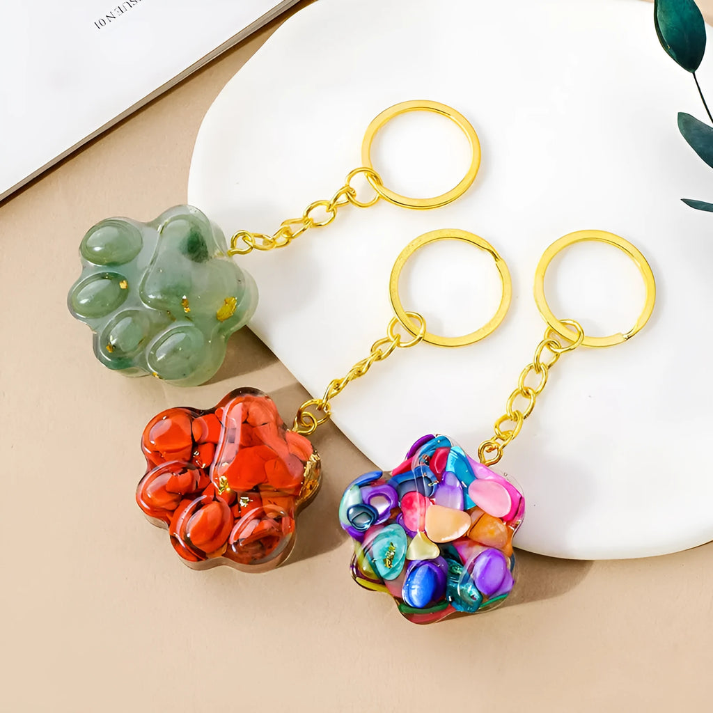 Natural crystal cat's paw keychain pendant in assorted gemstone colours on a keyring.