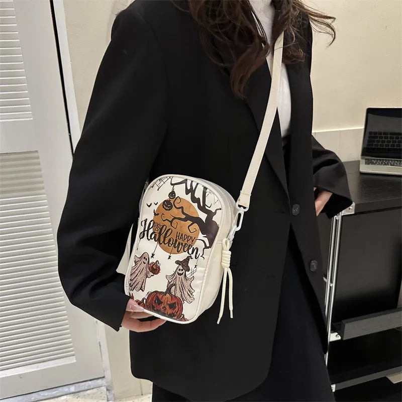 Halloween graffiti mini crossbody phone bag with cartoon pumpkin ghost bat print in black colour
