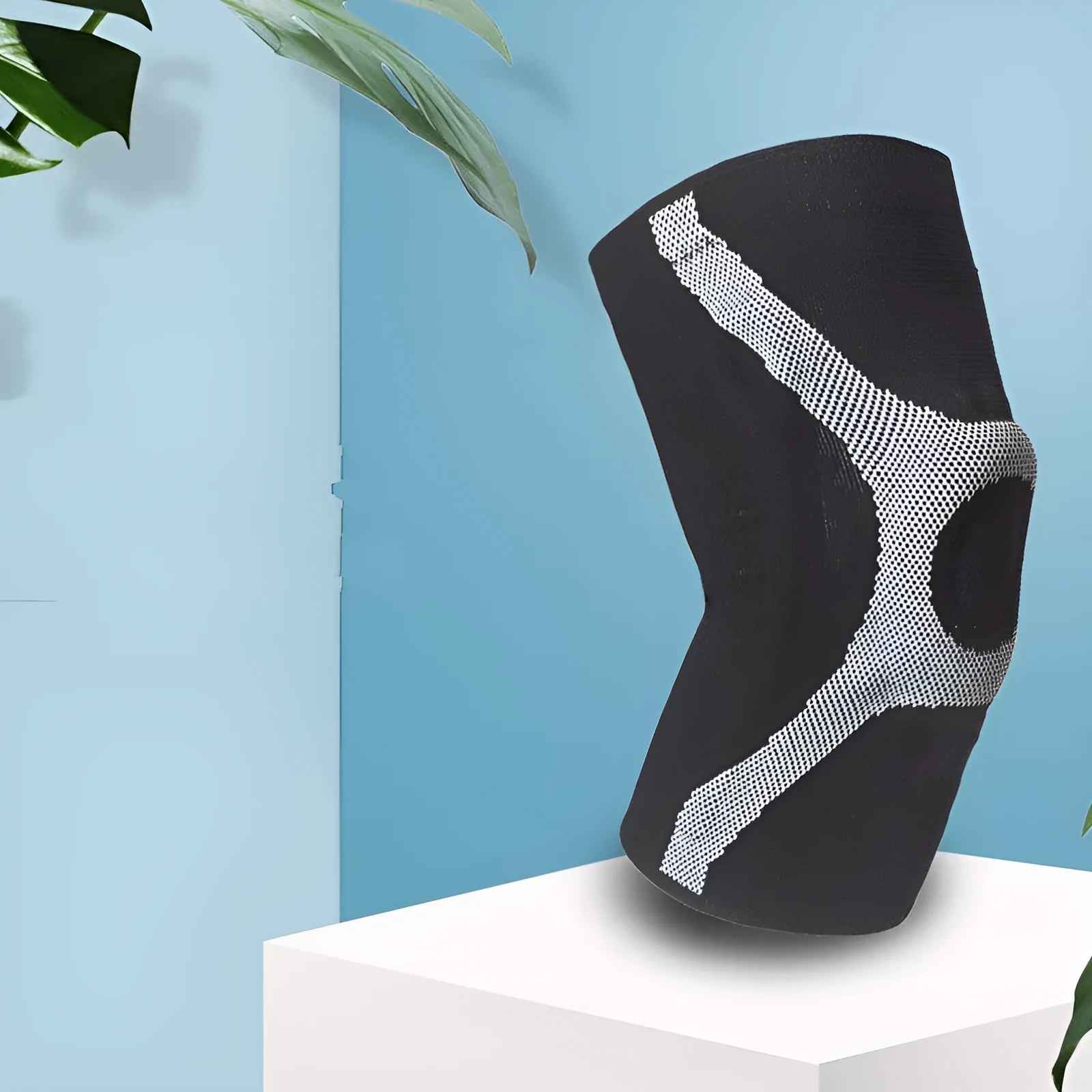 Silicone sports kneecap in red, showing knitted non-slip design for knee protection.