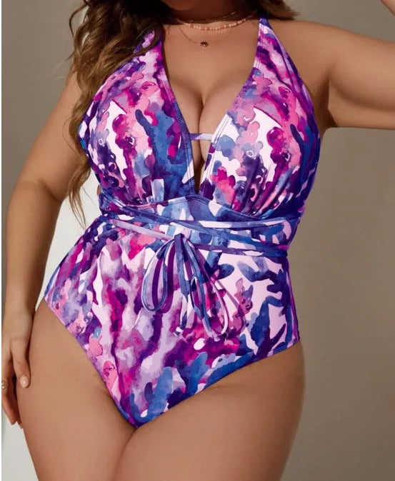 Purple solid colour women's halterneck one-piece swimsuit on a hanger