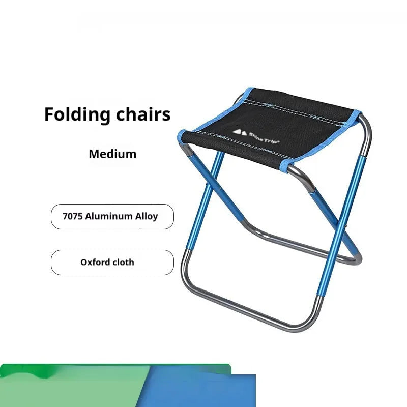 Black aluminium alloy folding stool in outdoor setting, shown in folded and unfolded positions.