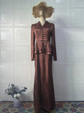 Dark brown retro dress with plants and flowers pattern, long sleeves, and fake two pieces styling