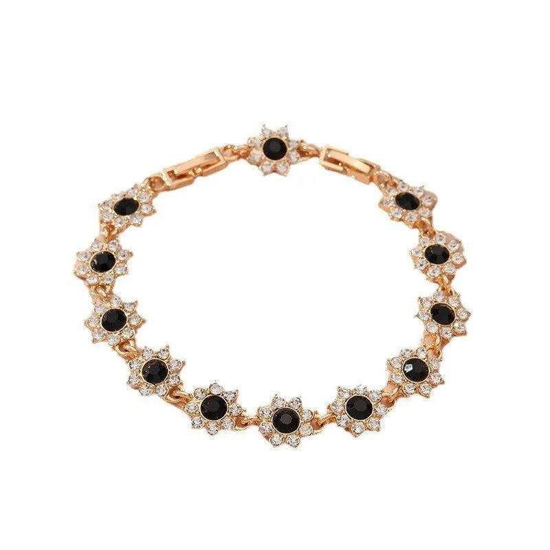Floral zinc alloy bracelet with electroplated gold or silver finish and gemstone colour variants
