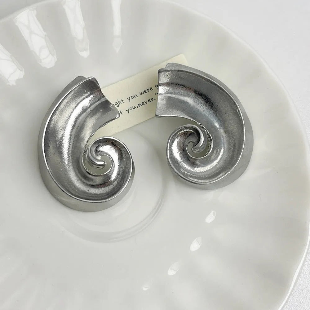 Geometric retro design ear studs in gold and silver colours measuring 5cm