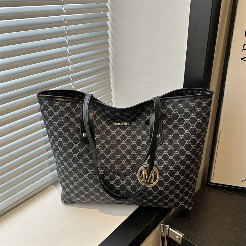 Street trend western style shoulder bag in PU material with sewn detailing, shown in black.