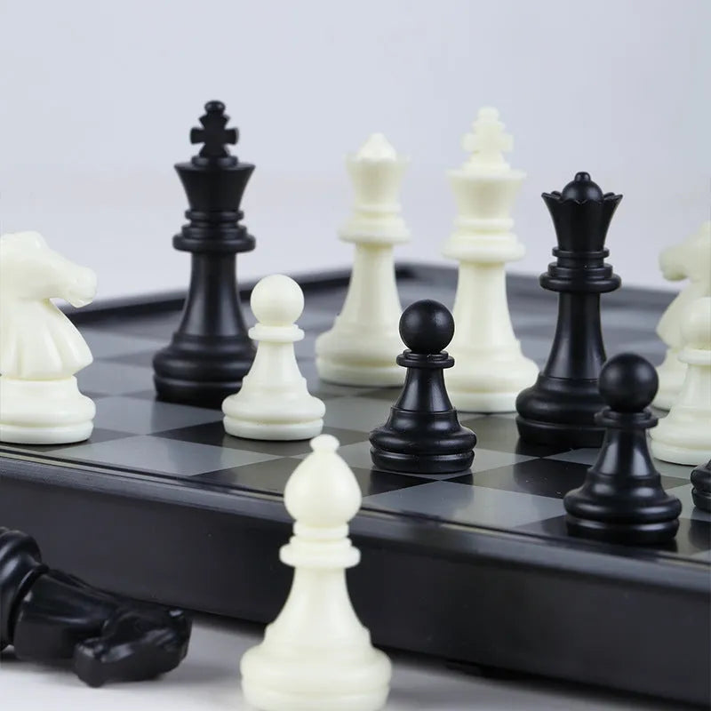 Portable folding ABS chessboard 32cm for students and children, open on a flat surface
