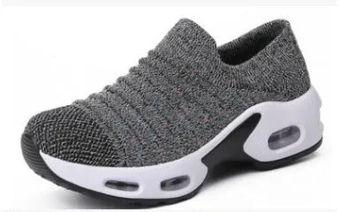 Women's stretch knitted sock shoes in various colours showing mesh upper and round toe design.