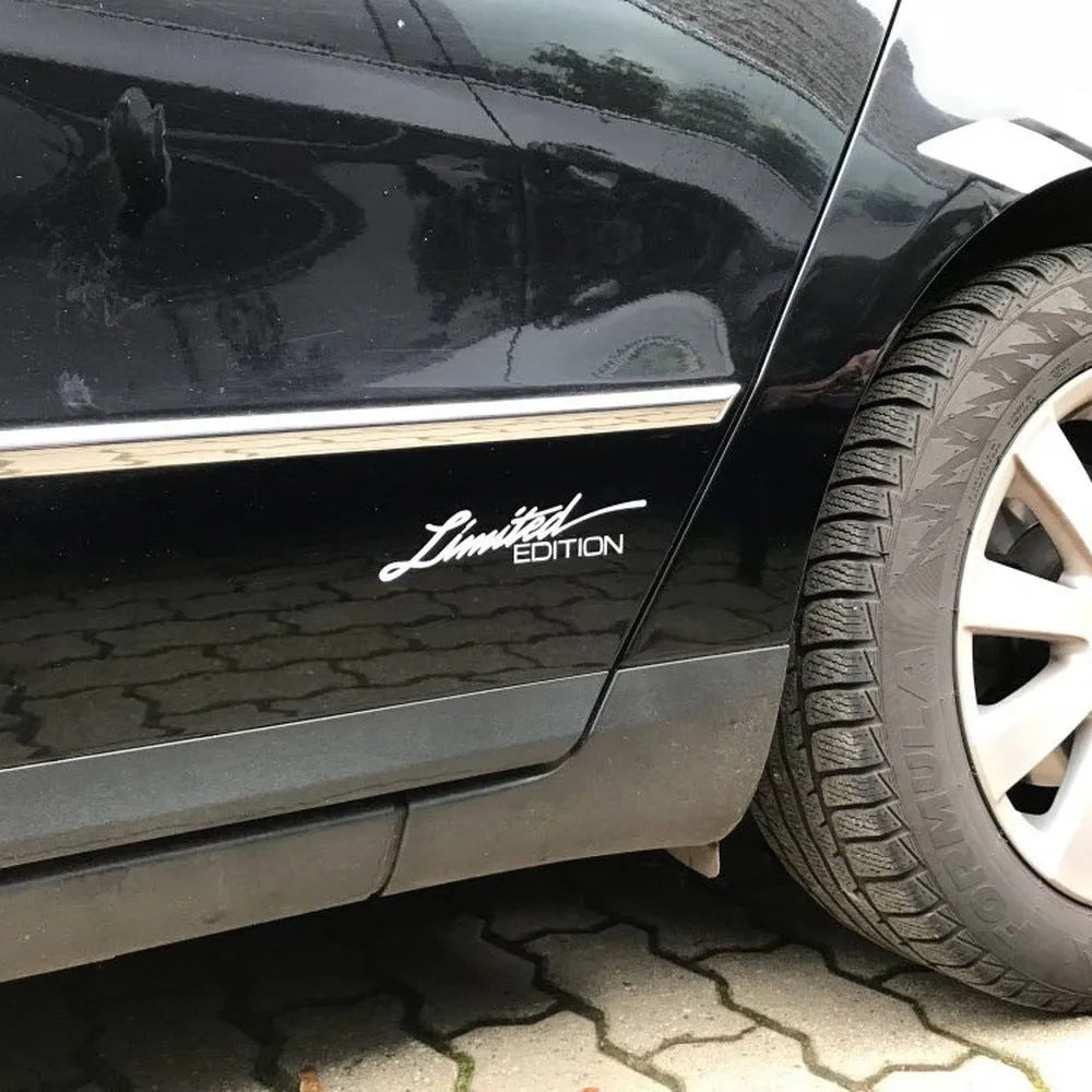 Reflective British-style bumper sticker measuring 16cm long, shown in black, white, and colourful variants.