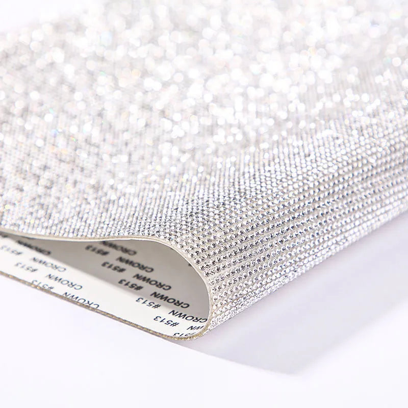 Rhinestone transfer sheet with hot fix glue backing showing eight-eye pattern in multiple colour options
