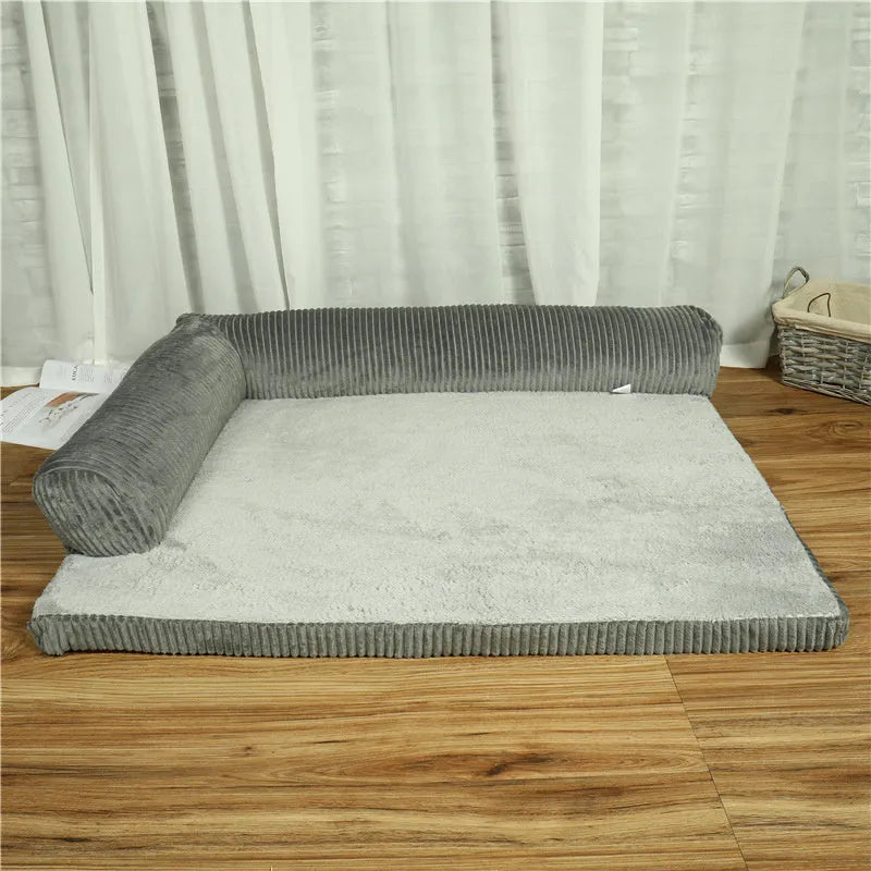 Corduroy bolster dog bed with non-slip base in grey, showing S M L XL size comparison.