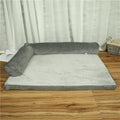 Corduroy bolster dog bed with non-slip base in grey, showing S M L XL size comparison.