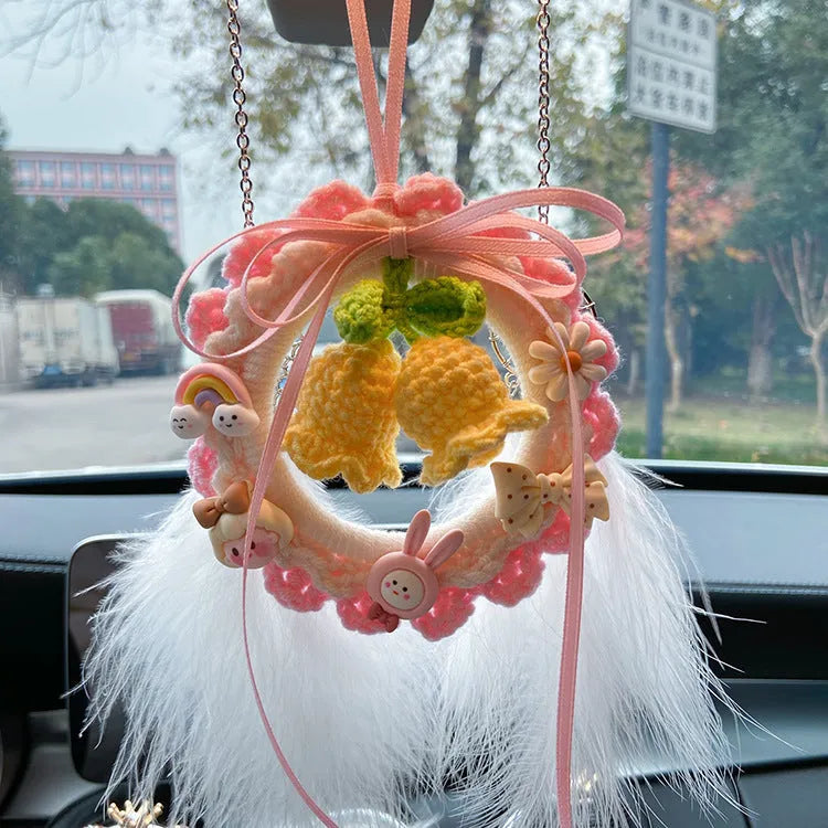 Woven wool bell orchid car pendant in green, pink, purple, and yellow colour options with dream catcher variations