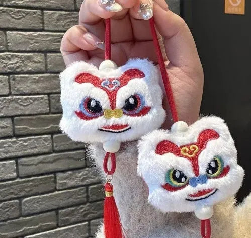 Chinese style blue plush lion keychain ornament with star stone detail and cartoon styling
