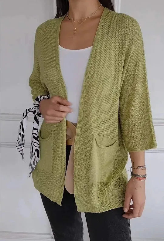 Women's thin waffle knit cardigan coat with nine-quarter sleeves and front pockets in army green.