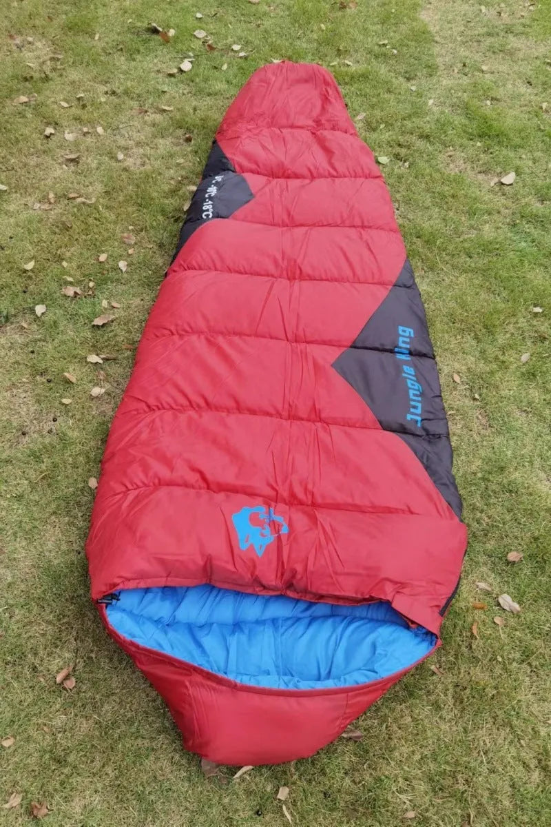 Outdoor cotton sleeping bag in Army Green with its compression sack, sized 230cm long.