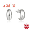 C-shaped sterling silver stud earrings with high polish gloss finish in gold colour