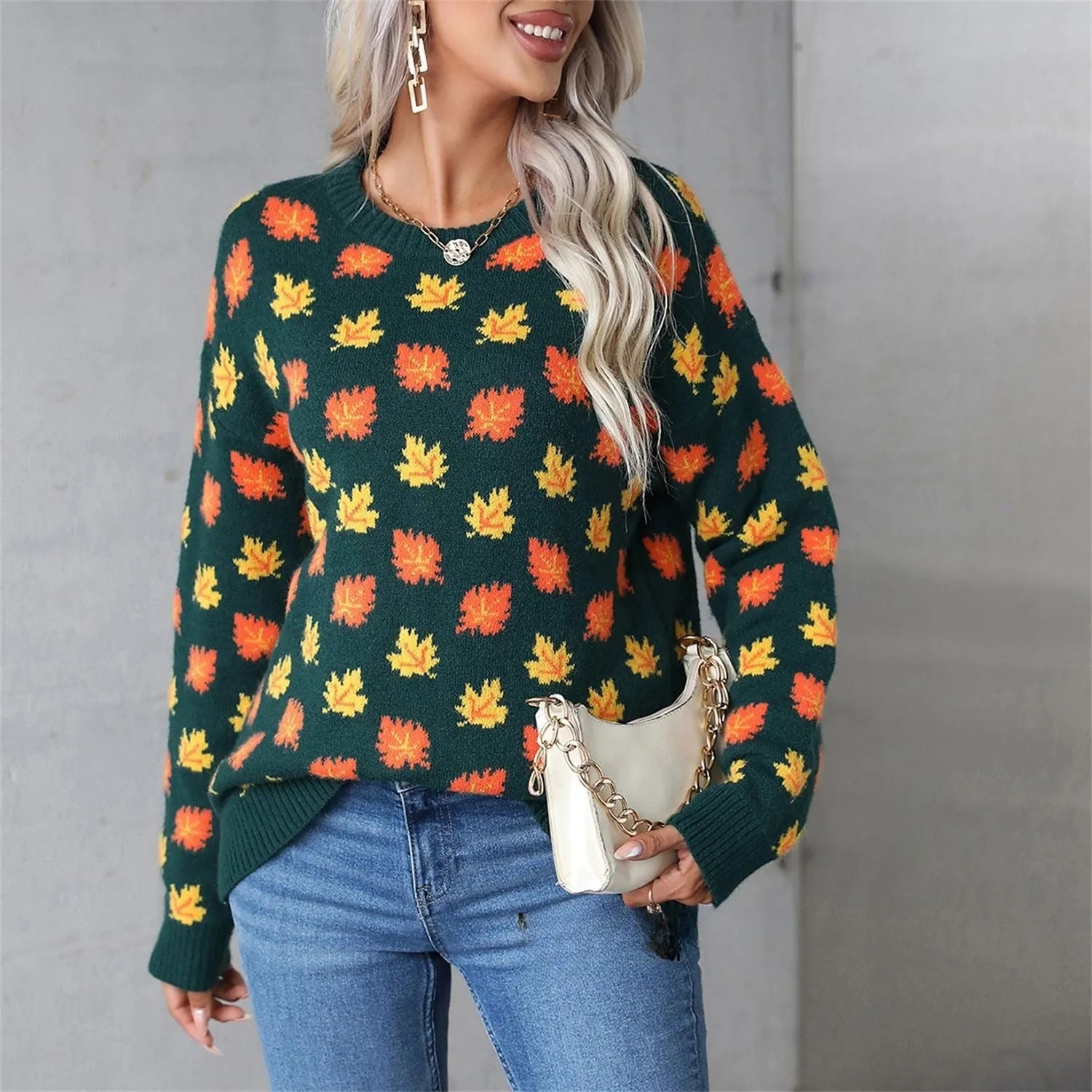Beige maple leaf round neck contrast colour loose fit polyester pullover sweater on model