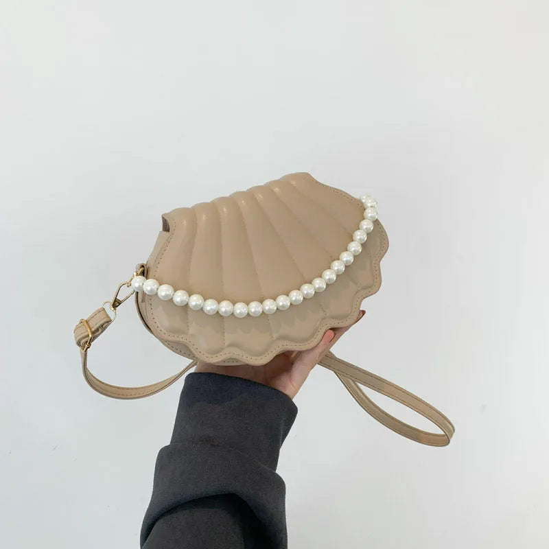 Women's simple messenger bag in PU shell shape with single shoulder strap, available in multiple colours