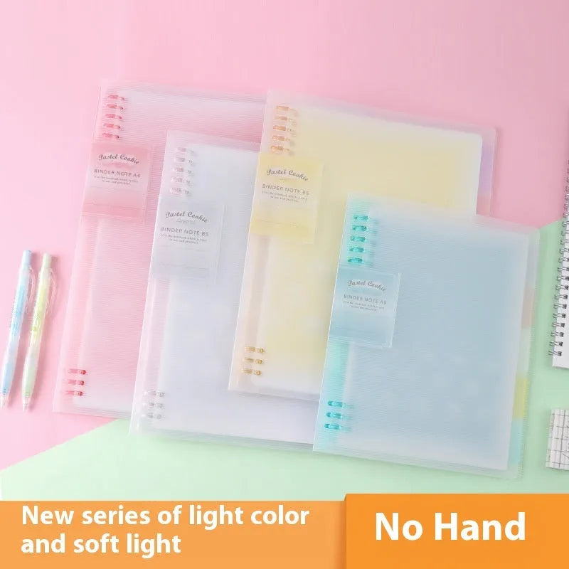 Loose-leaf spiral notebook with PP cover open, showing raw wood pulp pages in A5 or B5 size.
