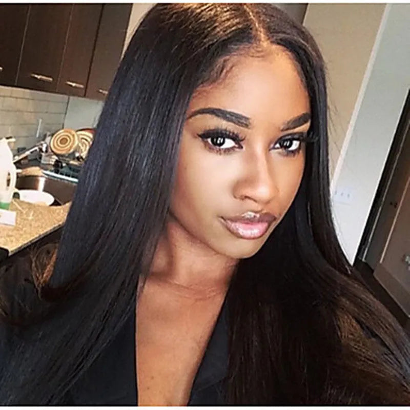 Long straight black synthetic wig with centre-parted bangs on a model.