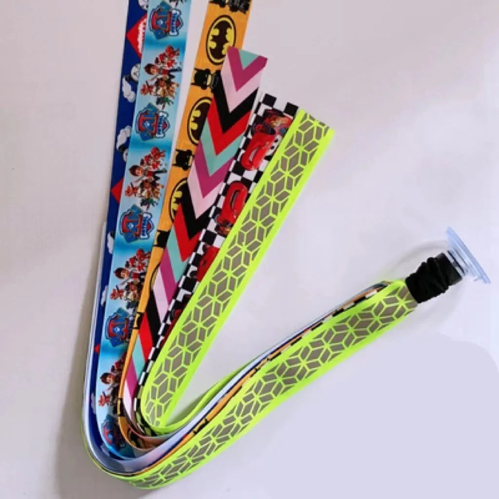 Colourful decorative ribbon streamers attached to a children safety helmet for skating or skiing