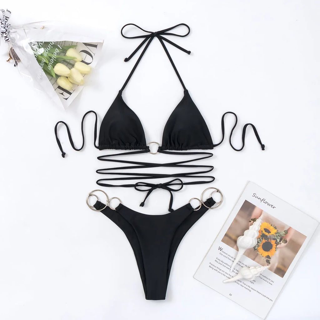 Black women's bikini set with metal ring straps and backless design