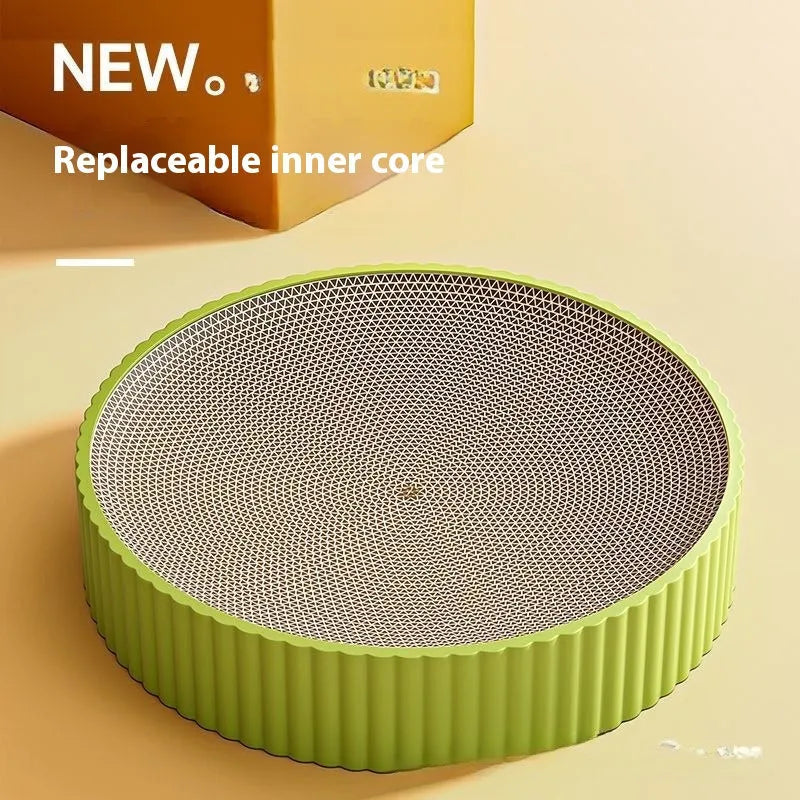 Green and white round cat scratching board with replaceable corrugated cardboard panels.