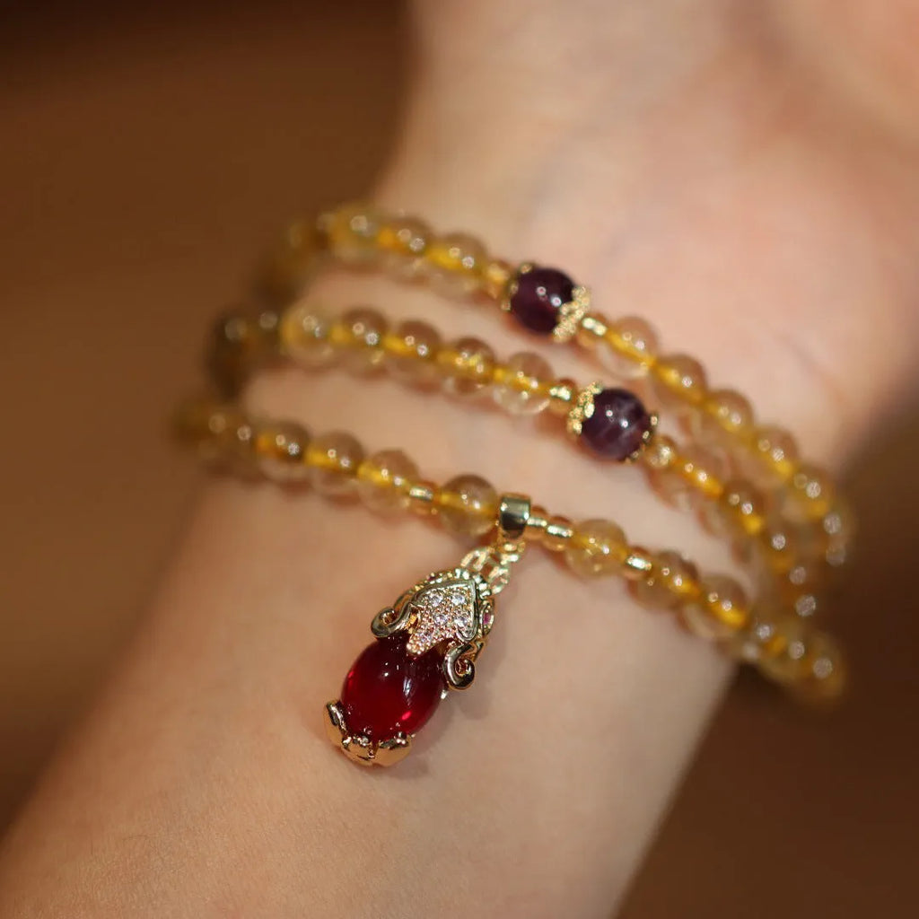 Handmade gold rutilated quartz bracelet with Chinese style hanging chopsticks and ruby quartz charm