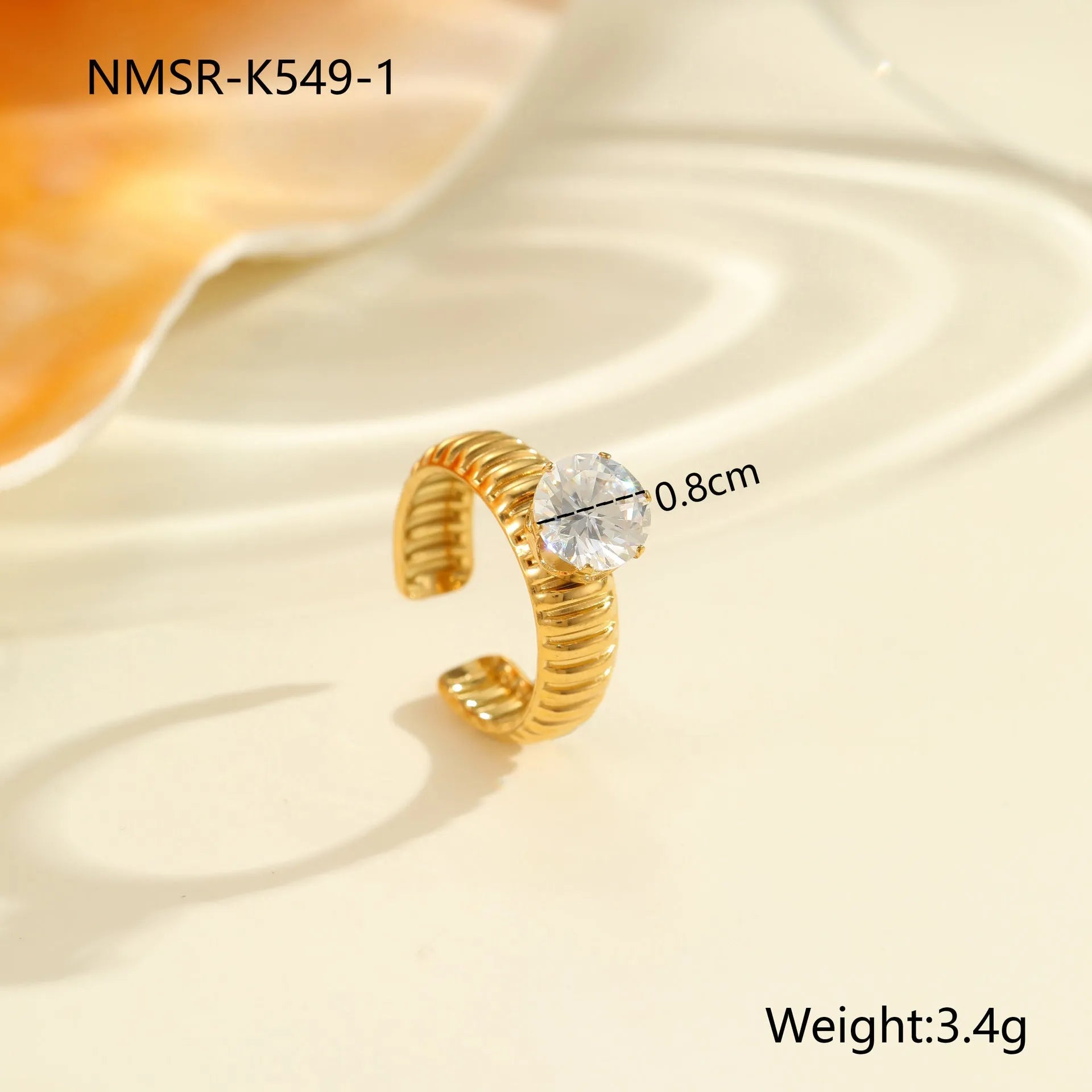 Stainless steel women's ring with gold electroplating and zircon details in geometry design