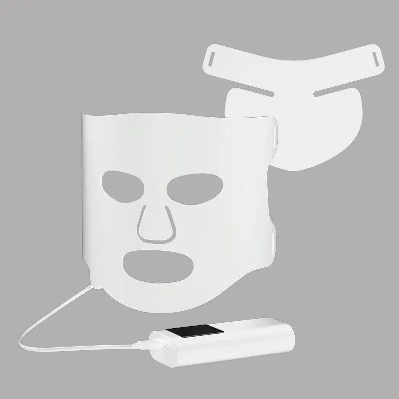 Black and gold LED phototherapy face mask with controller, shown with its USB charging cable.