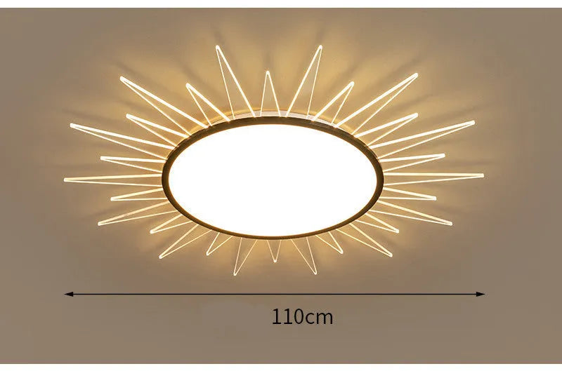 Modern round aluminium LED ceiling lamp with remote control on a white ceiling.