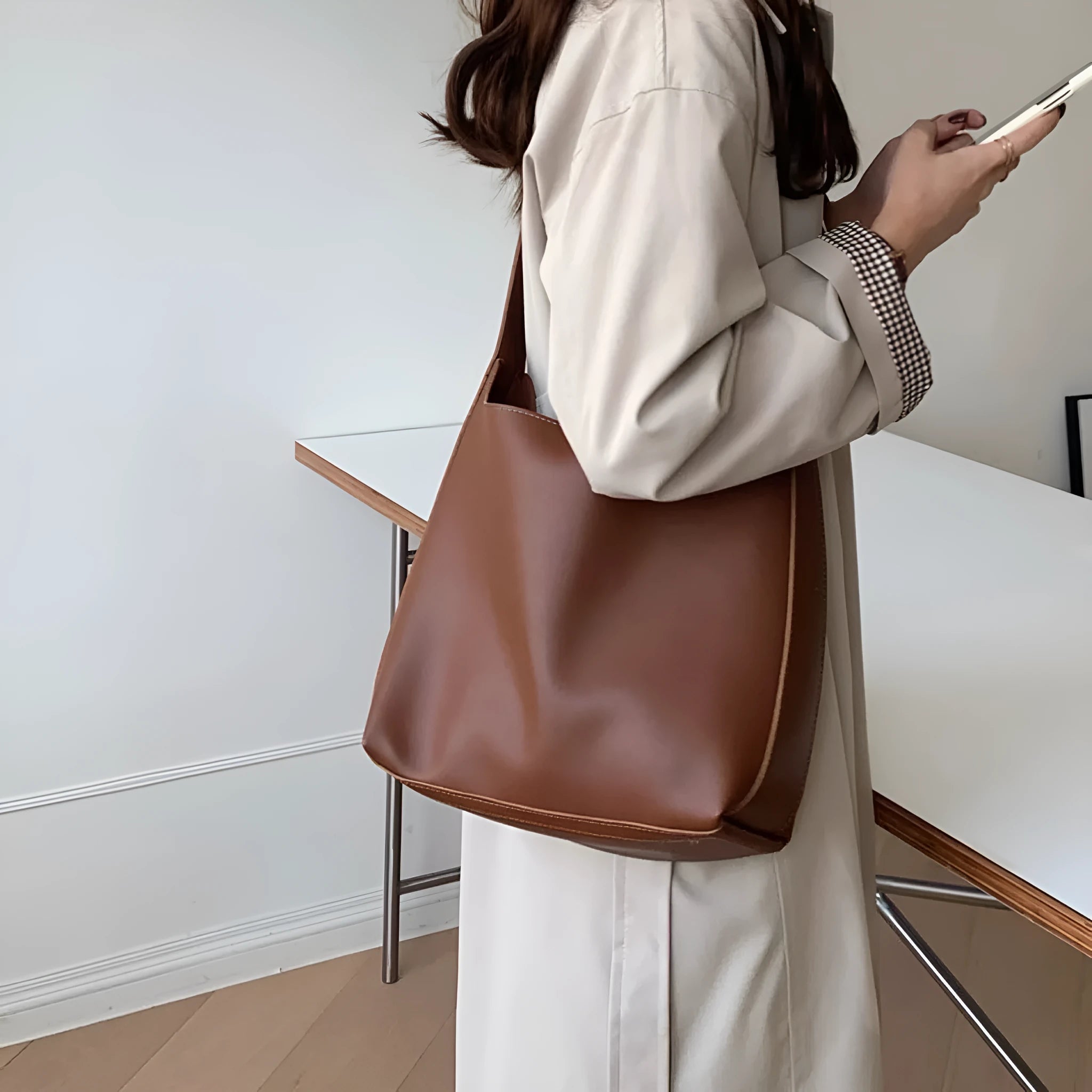 Women's black and brown shoulder bags with swinging threads and soft PU leather construction