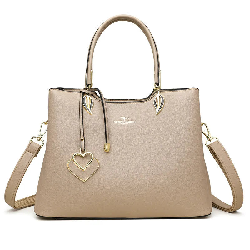 Women's black PU leather multi-compartment shoulder messenger bag with adjustable strap.
