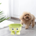 Green robot design elevated pet bowl with tilted feeding surface and detachable inner bowl