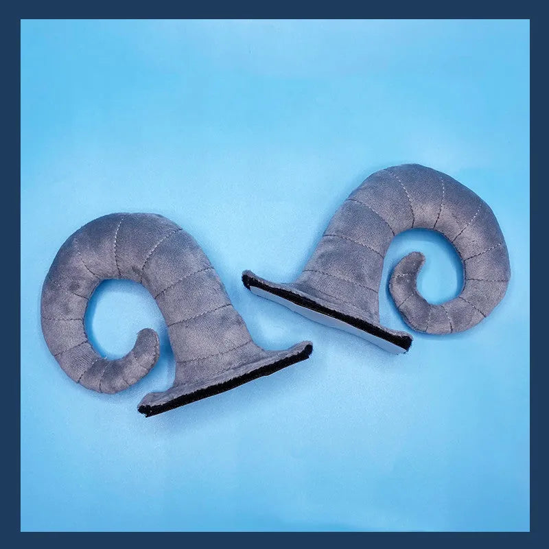 A pair of composite fibre demon bull horn ornaments for motorcycle helmet customisation.